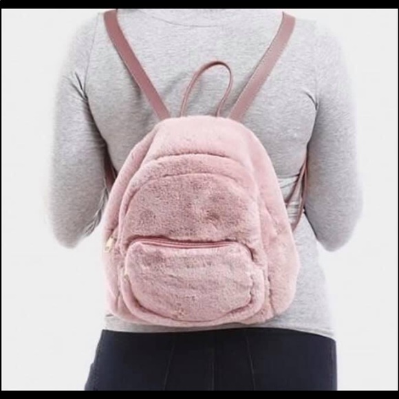 Accessories - $Firm Faux Fur Backpack